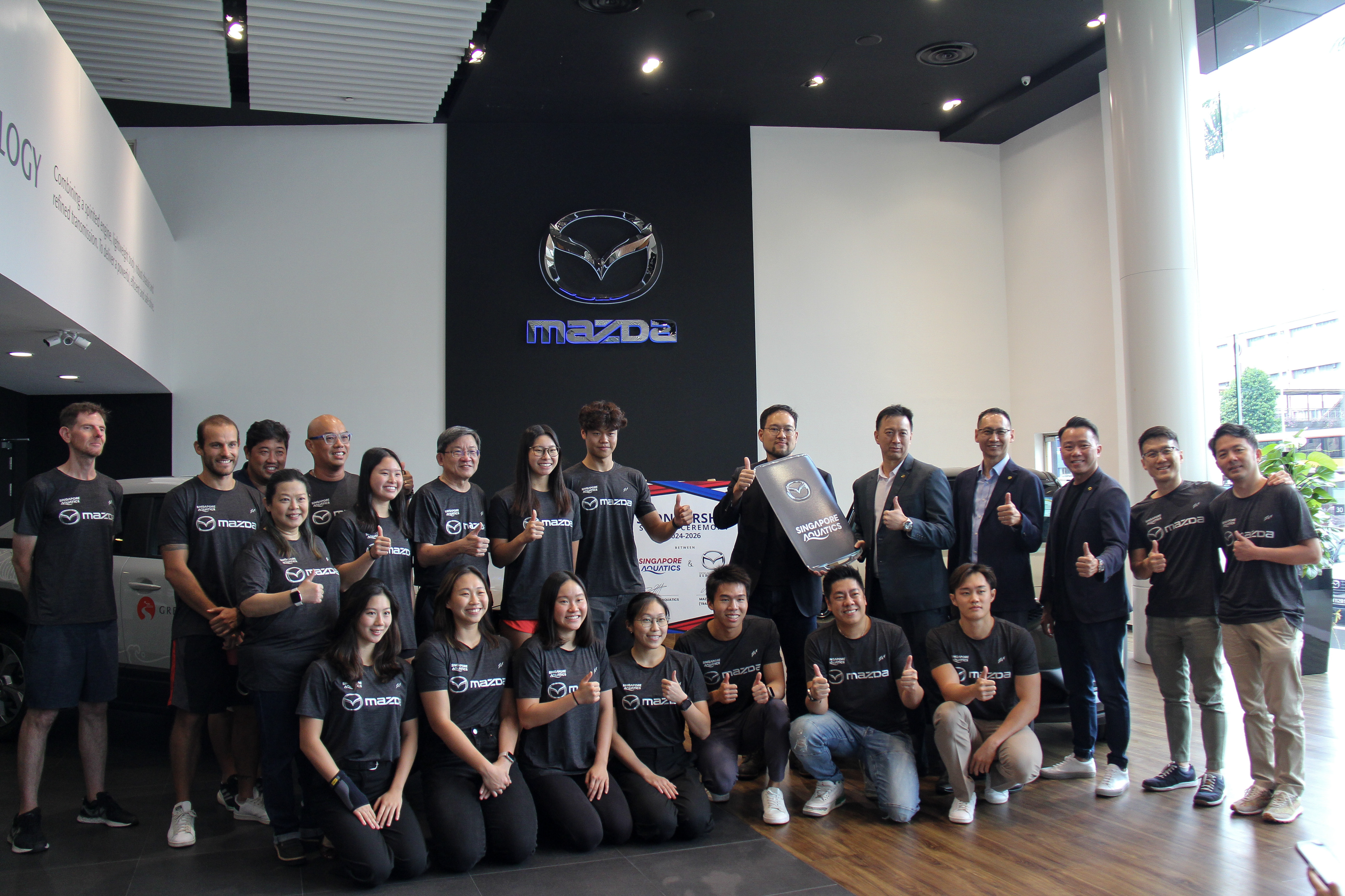 Singapore Aquatics’ Officials And Athletes With Representatives Of Trans Eurokars Mazda, Who Will Be The Association’S Official Car Partner And The Event Cars For The World Aquatics Swimming Wo